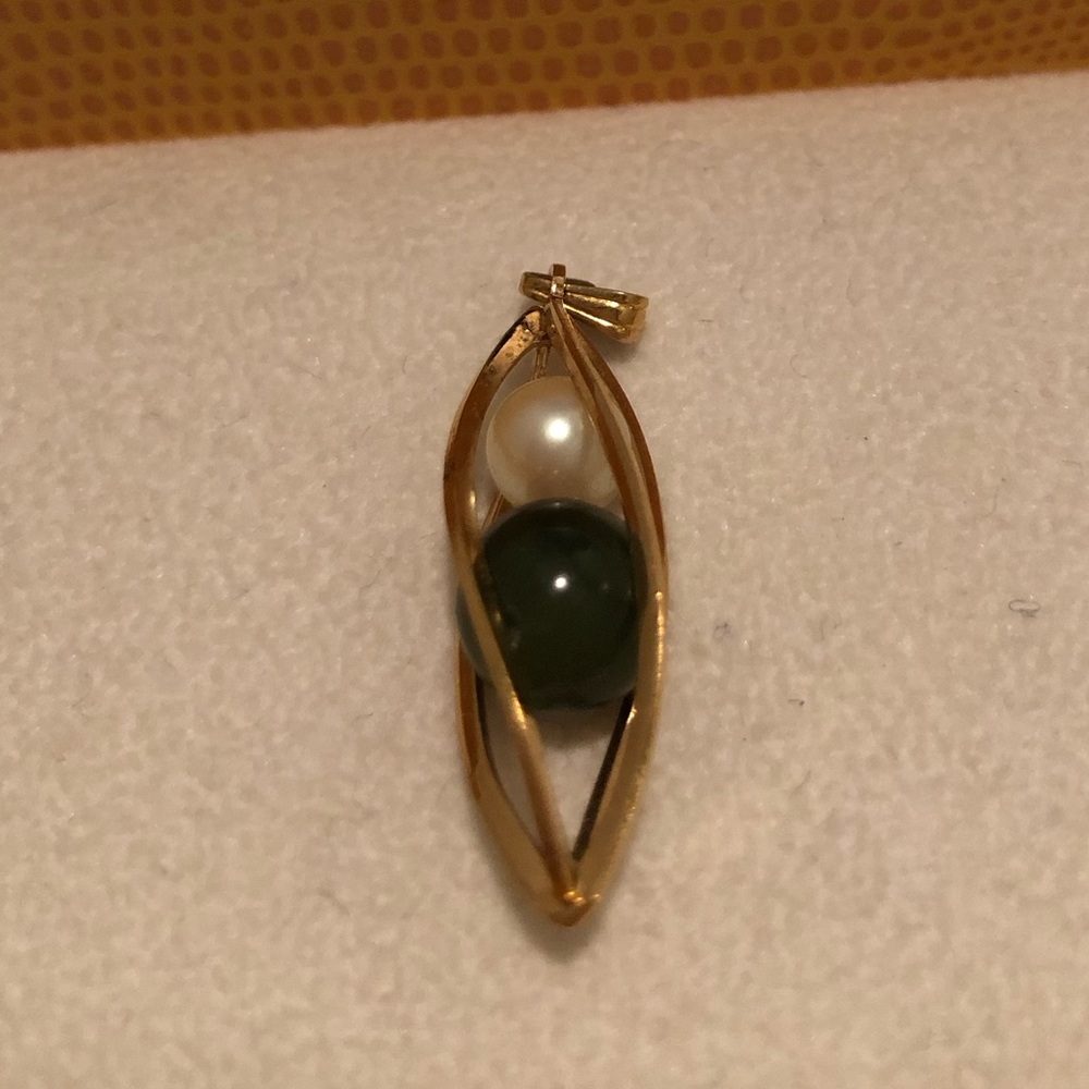 Elegant Gold Pendant with Green and White Accents